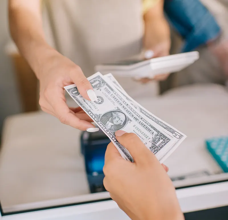 handing over cash